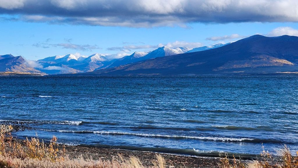 Kluane Lake with new snow on mountains 
